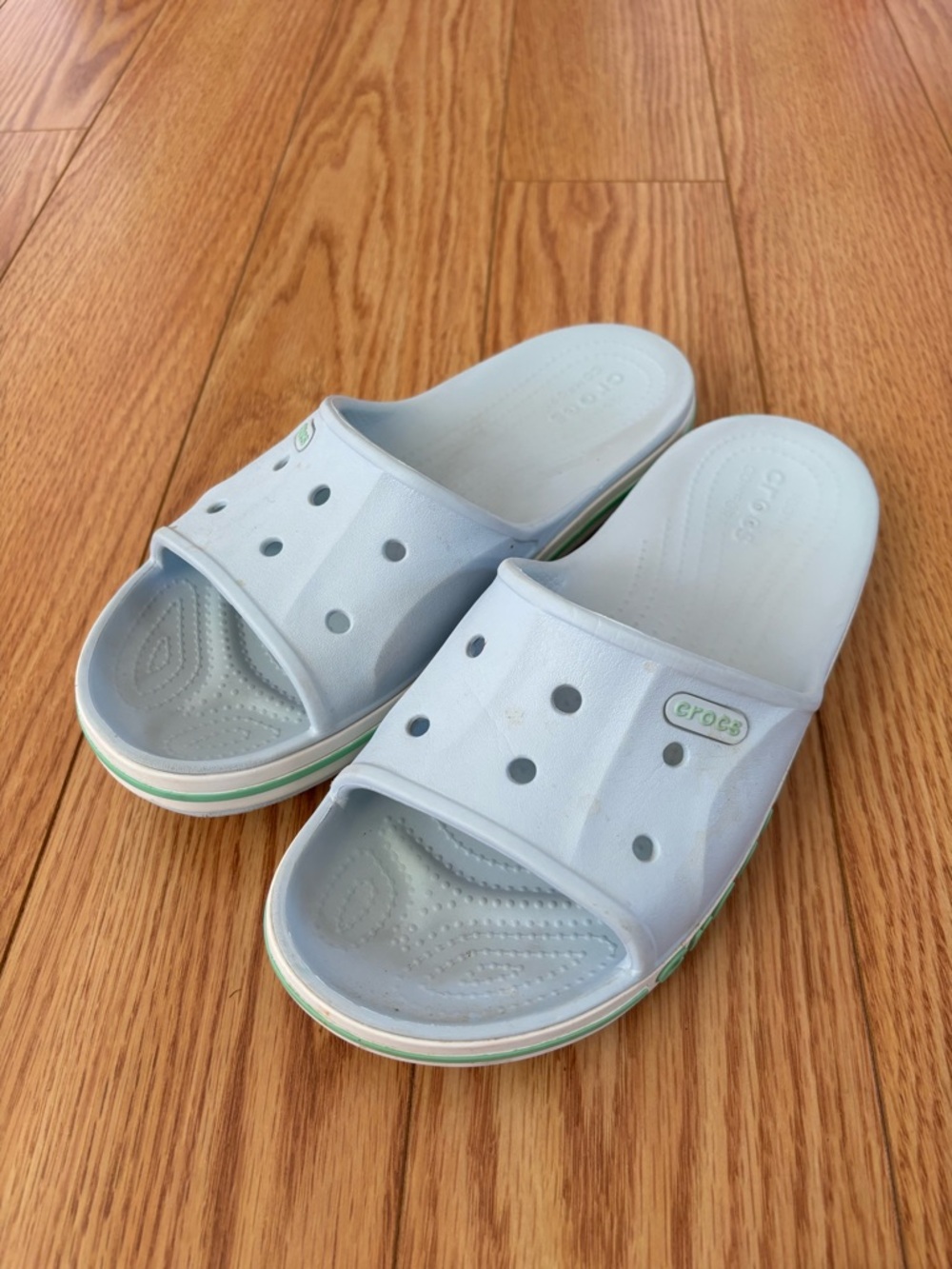 CROCS women’s Light Blue Slide Sandals with Green Trim